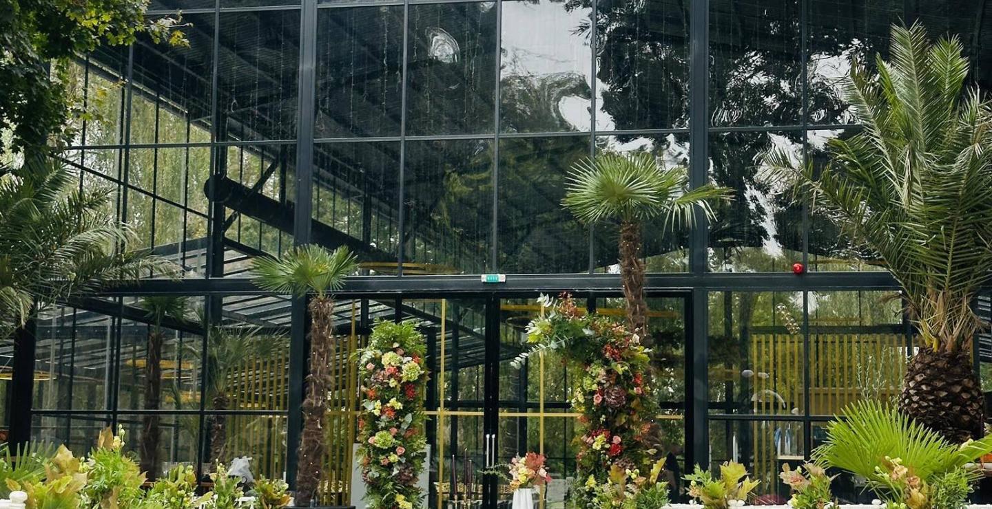a building with a fence in a garden