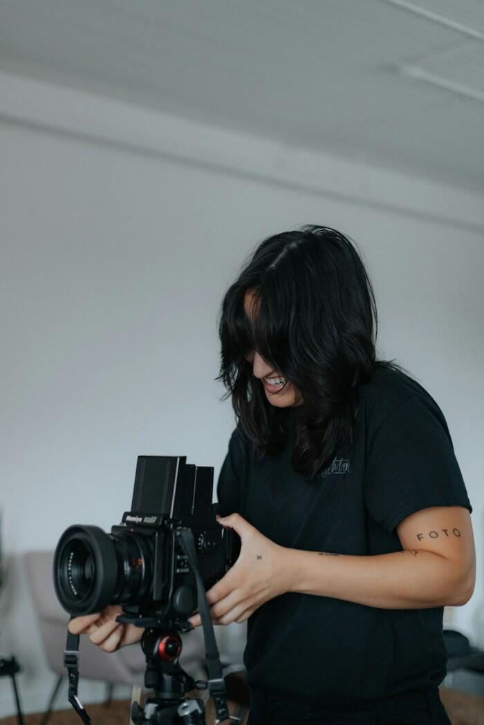 a person holding a camera