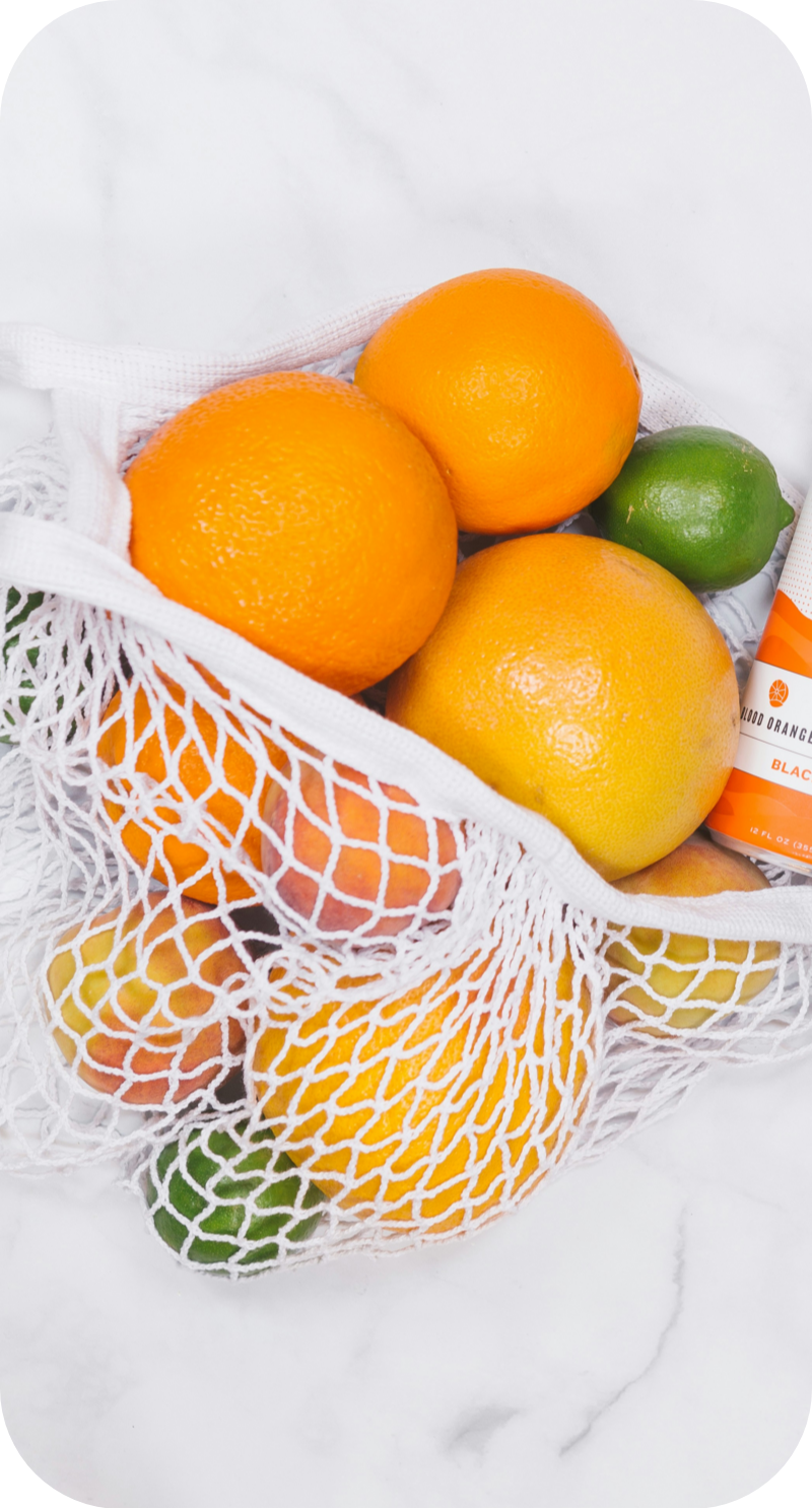 a bowl of oranges on a table