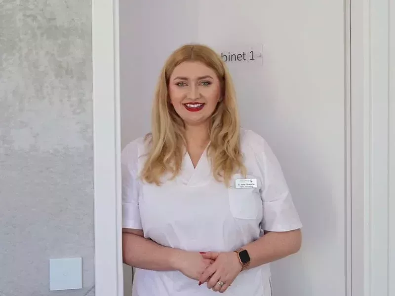 a woman standing in front of a door